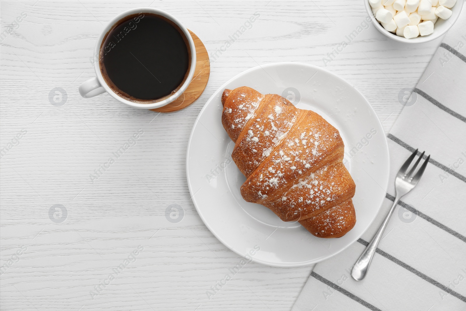 Photo of Delicious morning coffee and croissant on white wooden table, flat lay