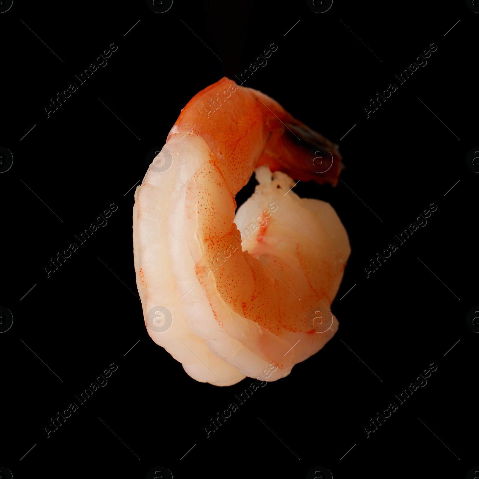 Photo of Freshly cooked delicious shrimp on black background