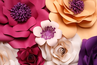 Different beautiful flowers made of paper as background, top view