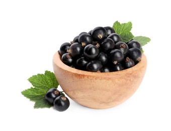 Ripe blackcurrants and leaves isolated on white