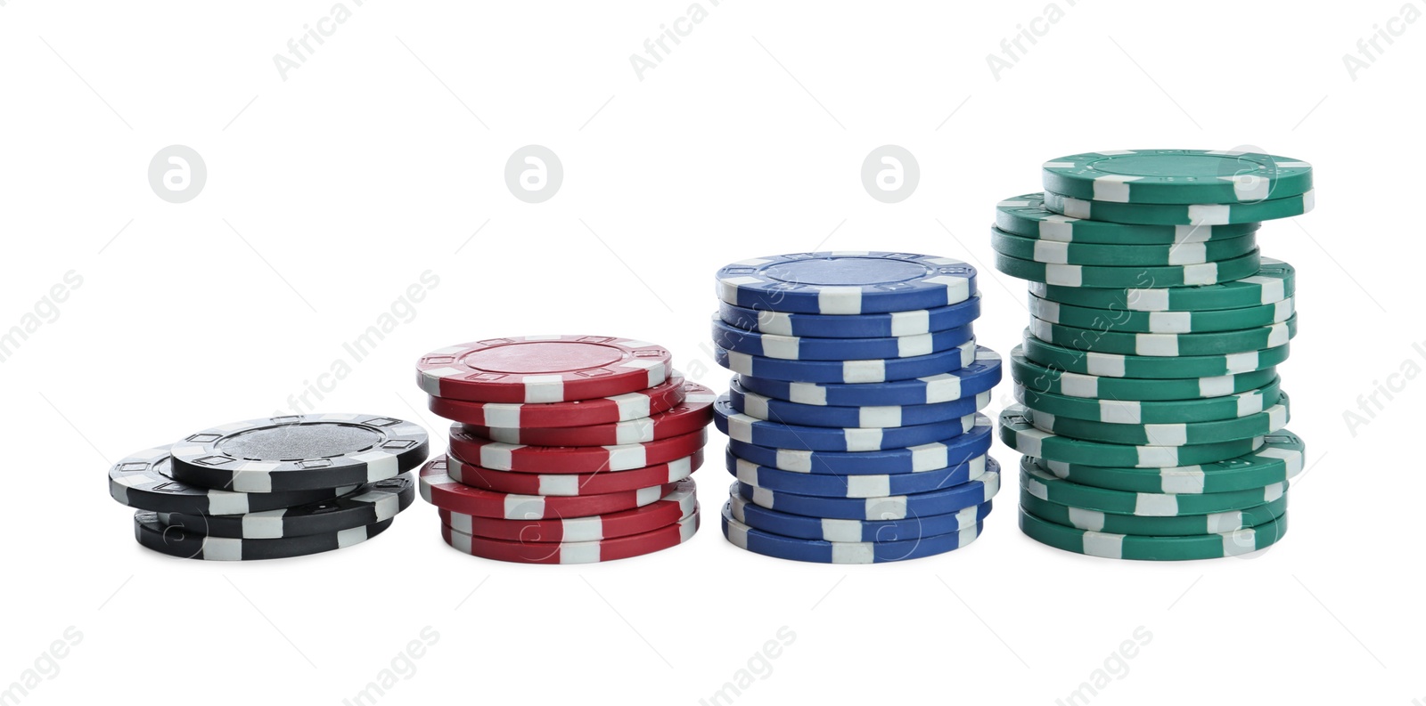 Photo of Plastic casino chips stacked on white background. Poker game