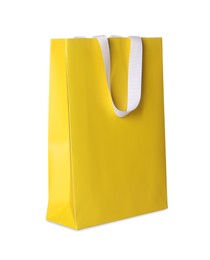 Photo of One yellow shopping bag isolated on white