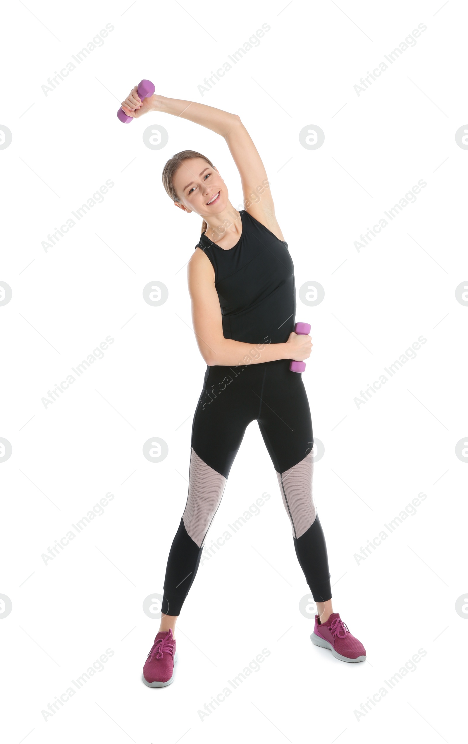 Photo of Young woman doing sports exercises isolated on white. Home fitness