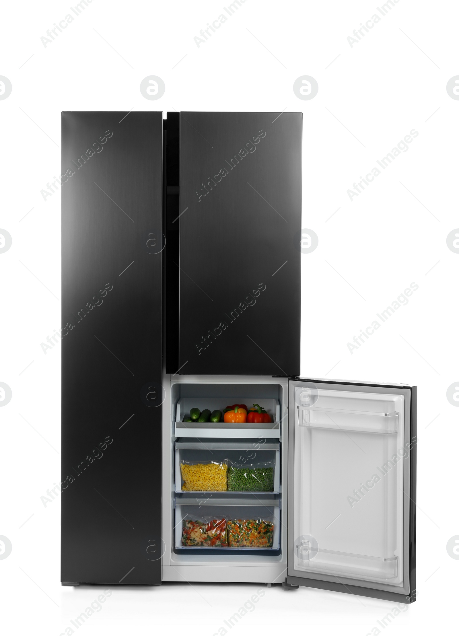 Photo of Open refrigerator filled with products isolated on white