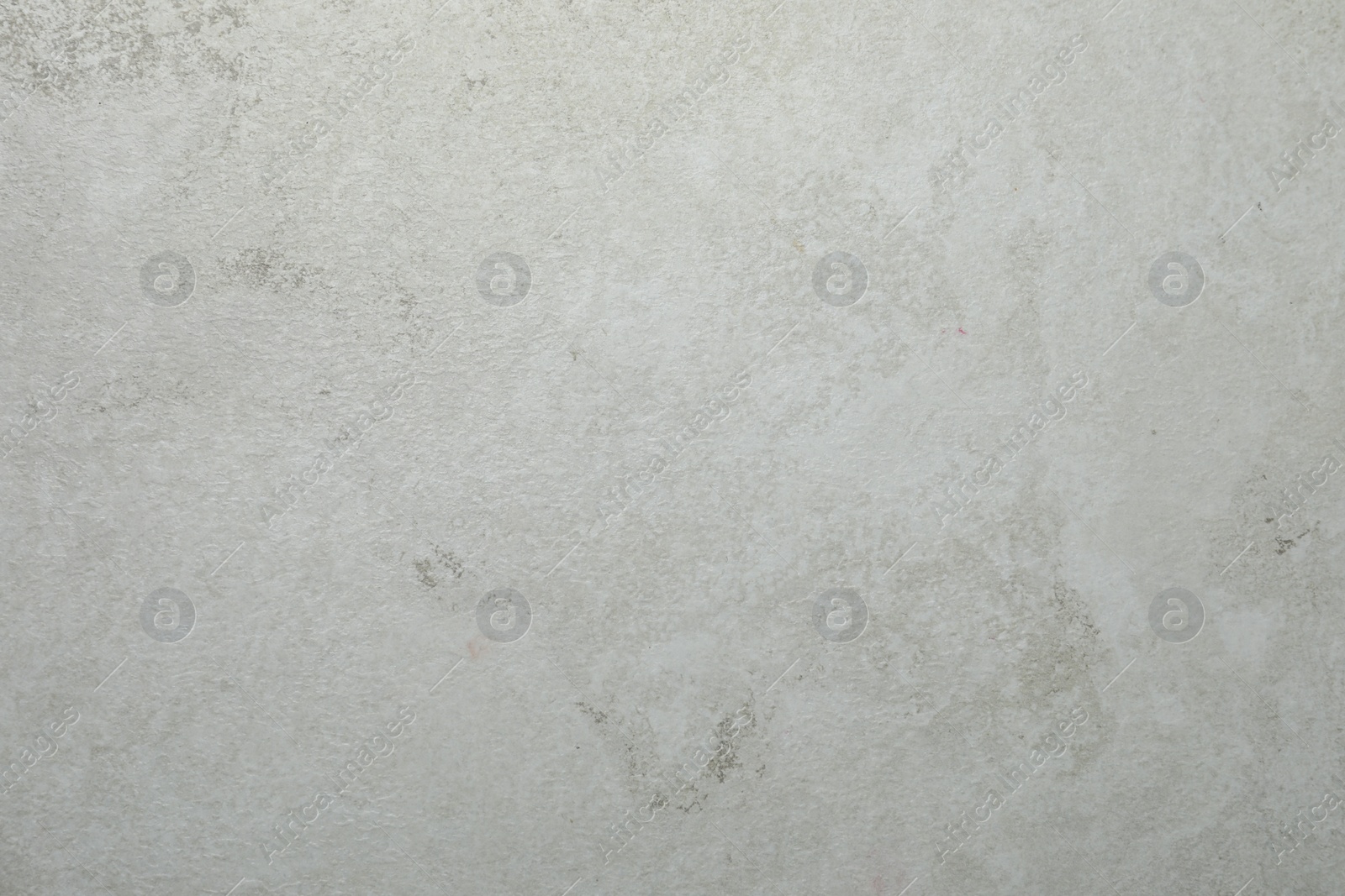 Photo of Texture of light grey stone surface as background, closeup