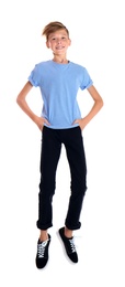 Portrait of young boy jumping on white background