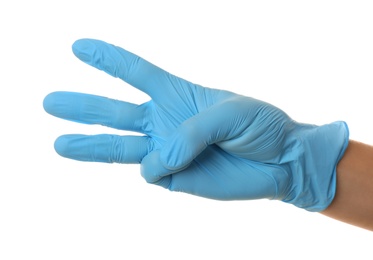 Person in blue latex gloves showing number three against white background, closeup on hand