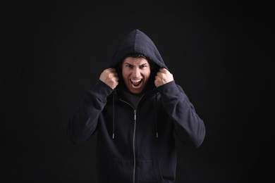 Portrait of emotional man on black background. Personality concept