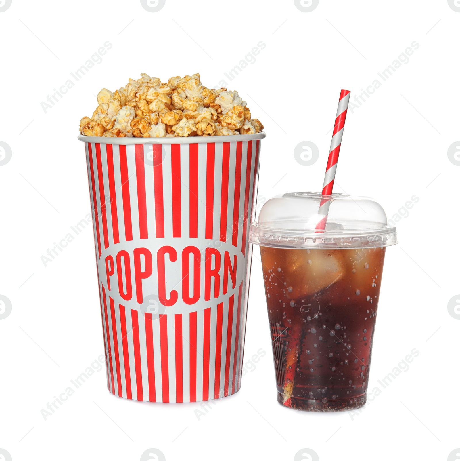 Photo of Carton cup with delicious fresh popcorn and iced cola on white background