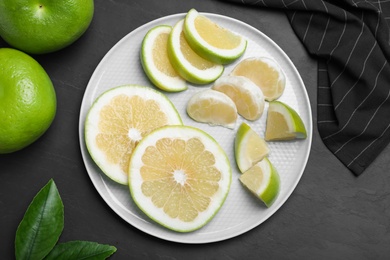 Fresh ripe sweeties on black table, flat lay