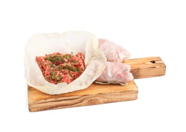 Wooden board with stuffed cabbage rolls isolated on white