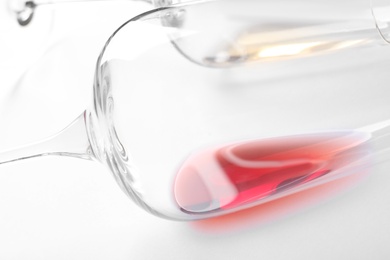 Glasses with red wine on white background, closeup