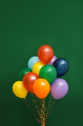 Bunch of bright balloons on color background. Celebration time