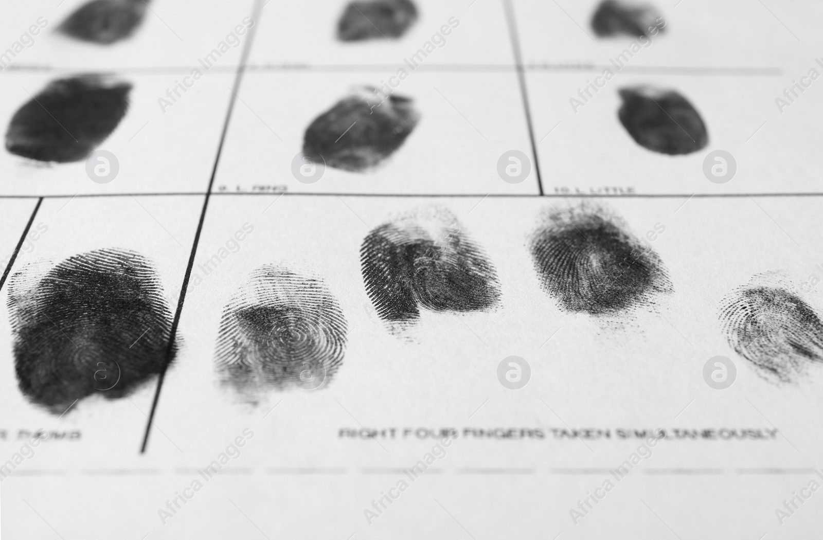 Photo of Police form with fingerprints, closeup. Forensic examination