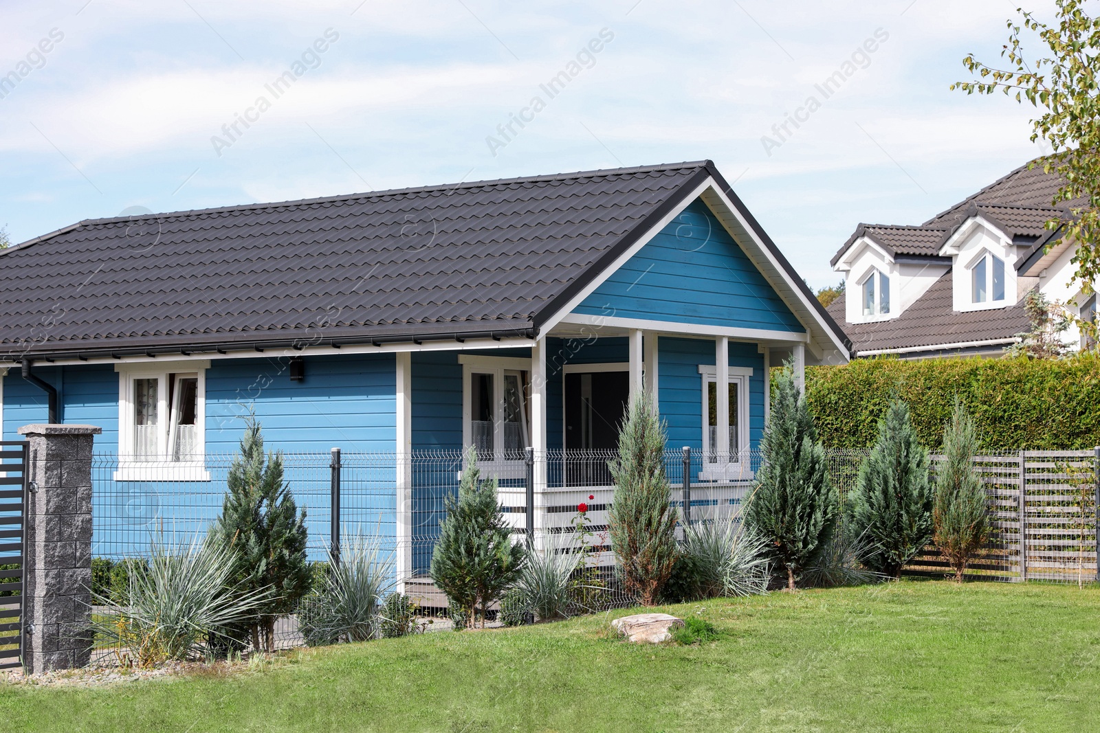 Photo of Exterior of beautiful modern blue house outdoors