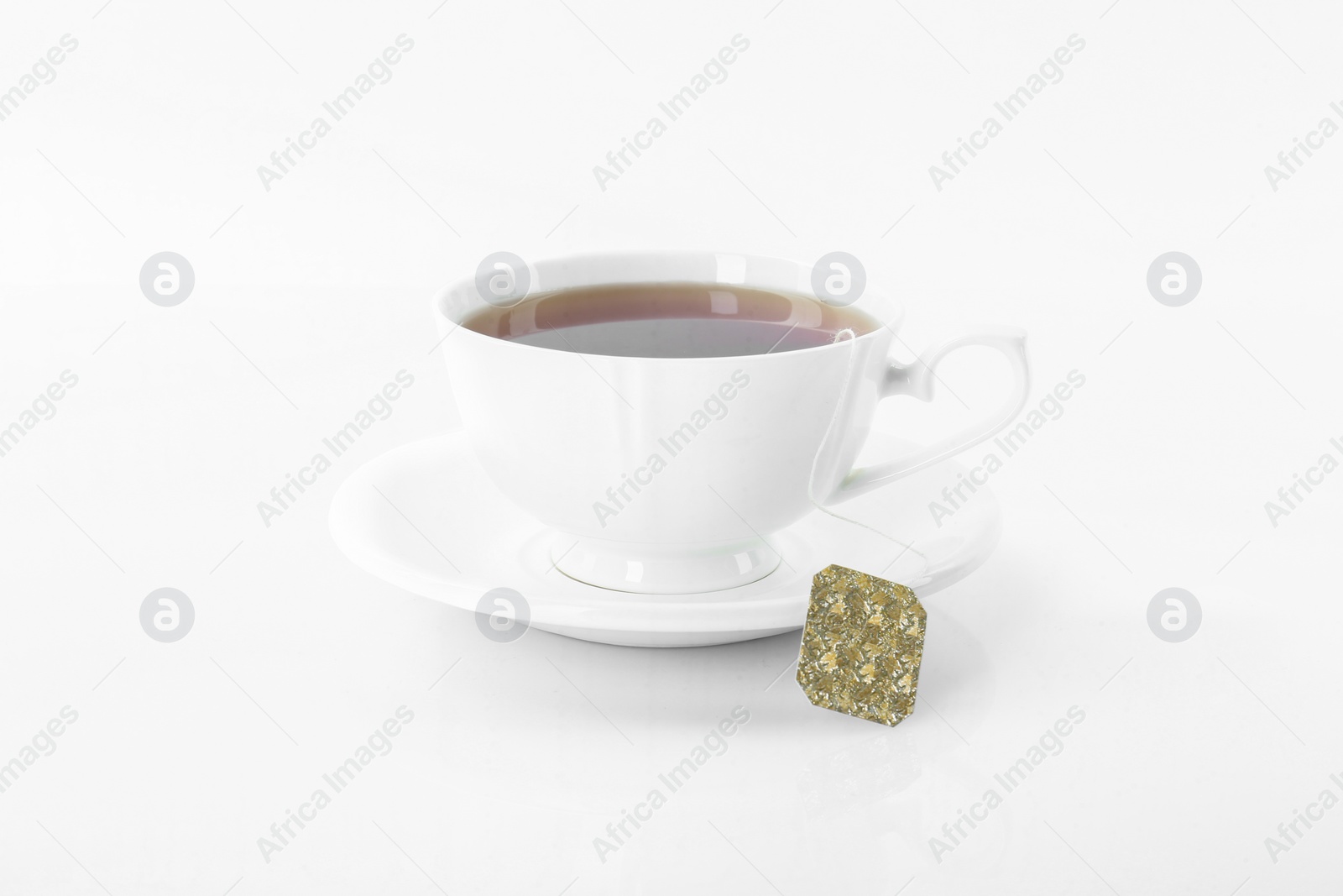 Photo of Tasty tea in cup on white background