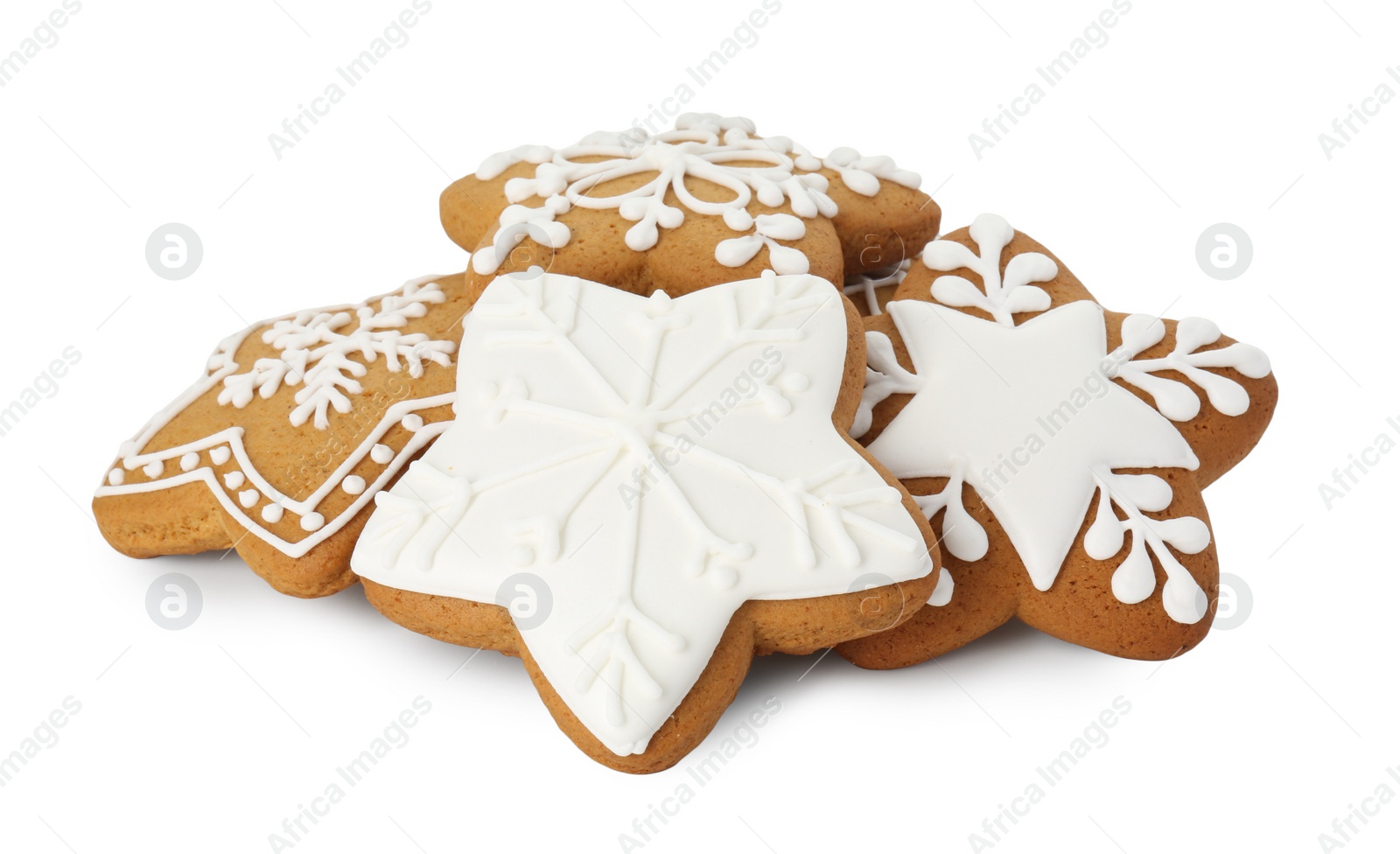 Photo of Tasty star shaped Christmas cookies with icing isolated on white