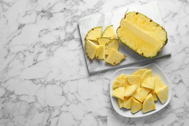 Composition with fresh sliced pineapple on marble background