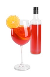 Photo of Bottle and glass of tasty Aperol spritz cocktail isolated on white