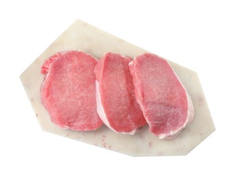 Photo of Board with pieces of raw pork meat isolated on white, top view