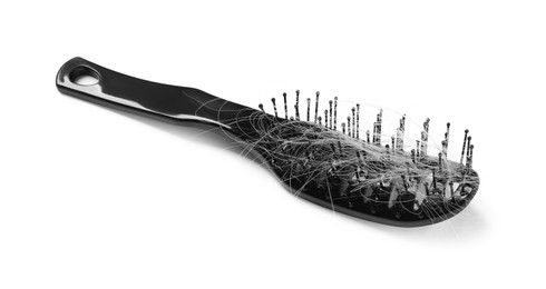 Photo of Brush with lost hair isolated on white