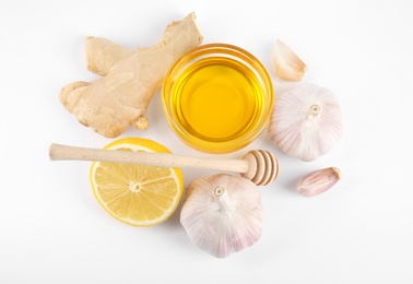 Photo of Composition with garlic and other cold remedies on white background, top view