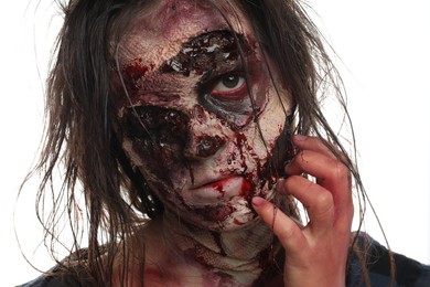 Photo of Scary zombie on white background, closeup. Halloween monster