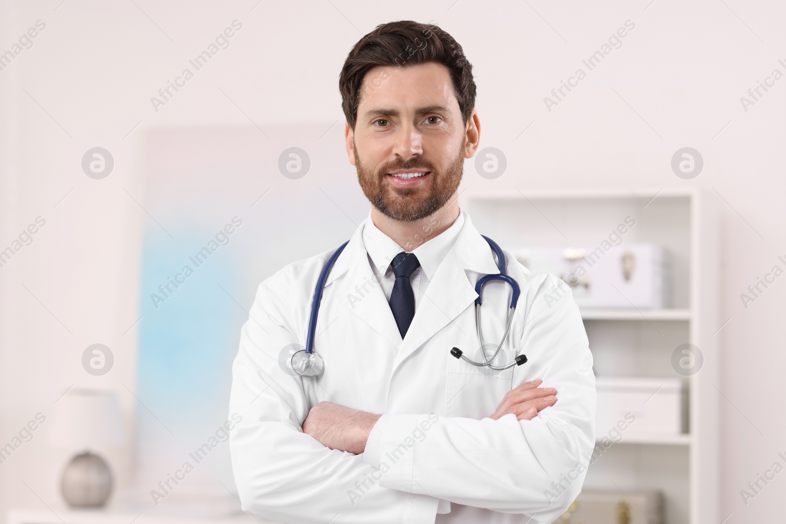 Photo of Portrait of medical consultant with stethoscope in clinic