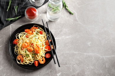 Delicious pasta with shrimps on plate