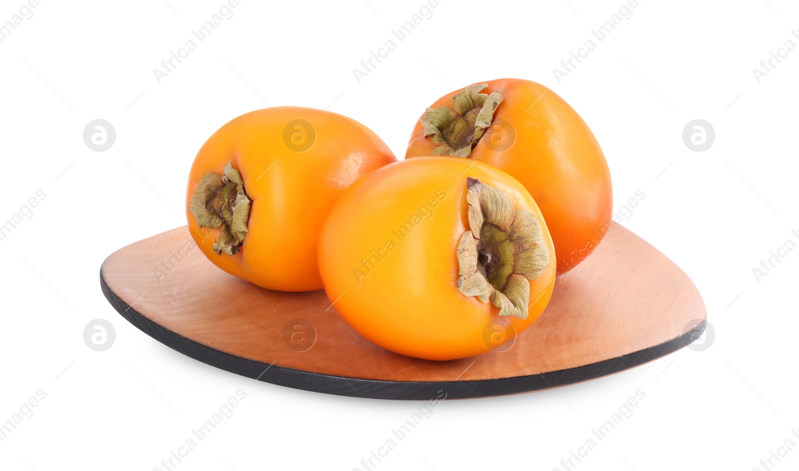 Photo of Delicious ripe juicy persimmons in wooden plate isolated on white