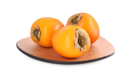 Photo of Delicious ripe juicy persimmons in wooden plate isolated on white