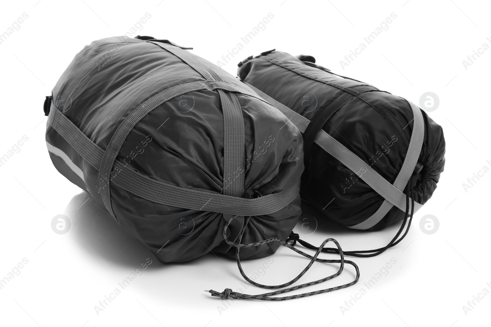 Photo of Sleeping bags on white background. Camping equipment