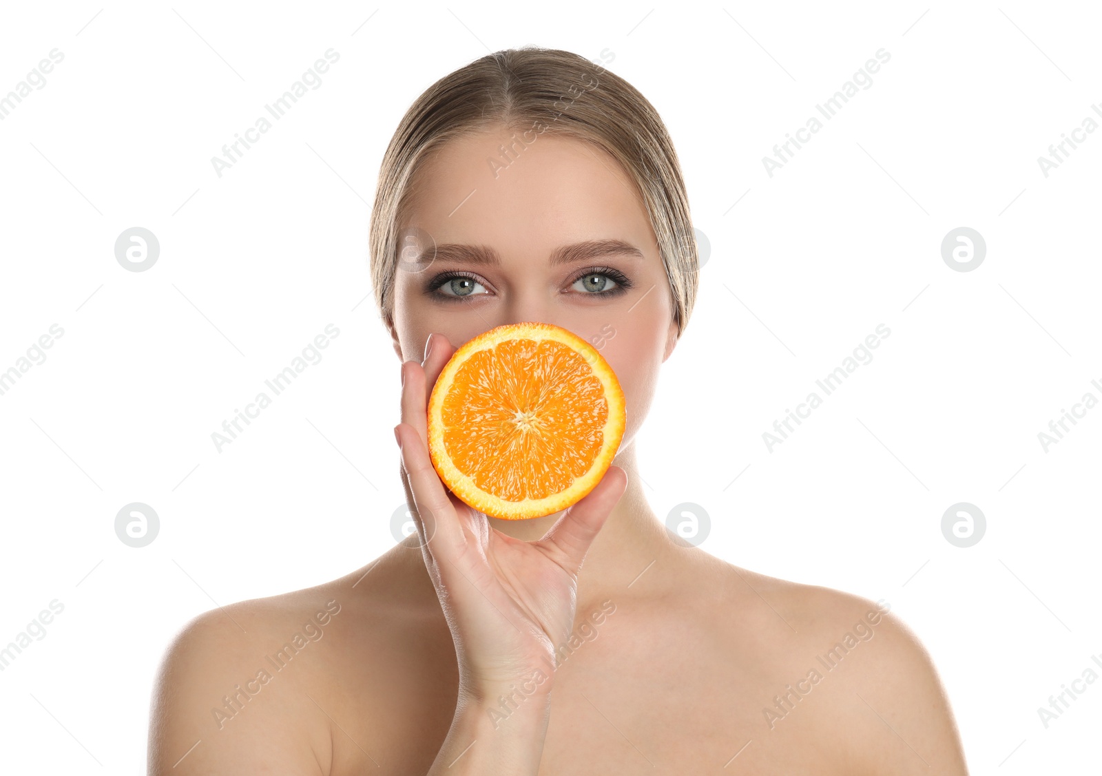 Photo of Young woman with cut orange on white background. Vitamin rich food