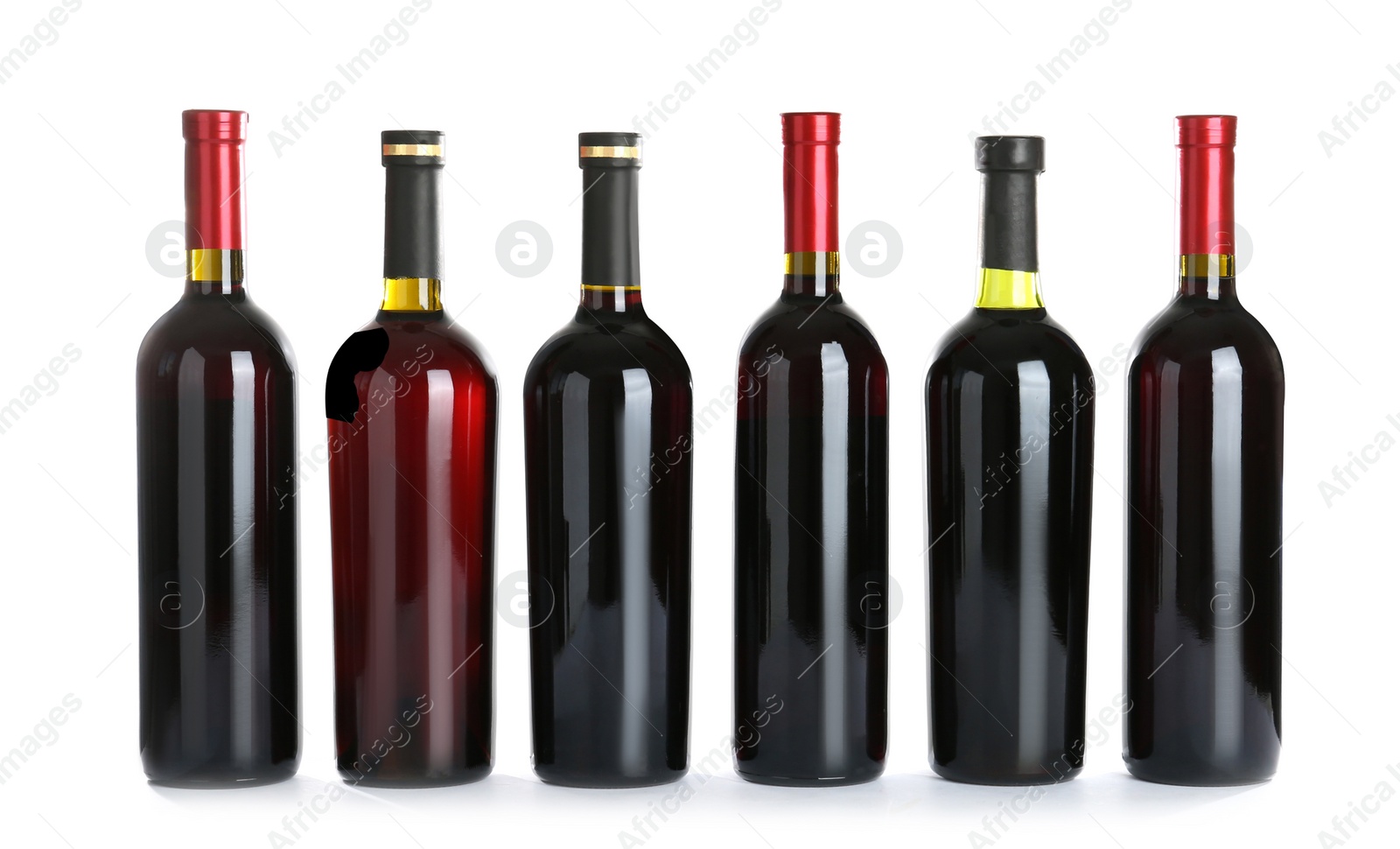 Photo of Bottles with red wine on white background