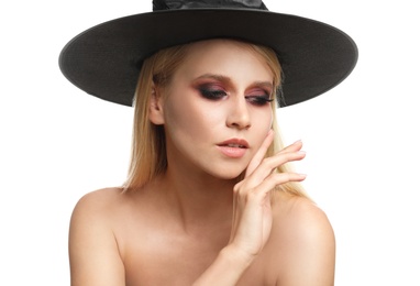 Photo of Witch in black hat isolated on white. Scary fantasy character