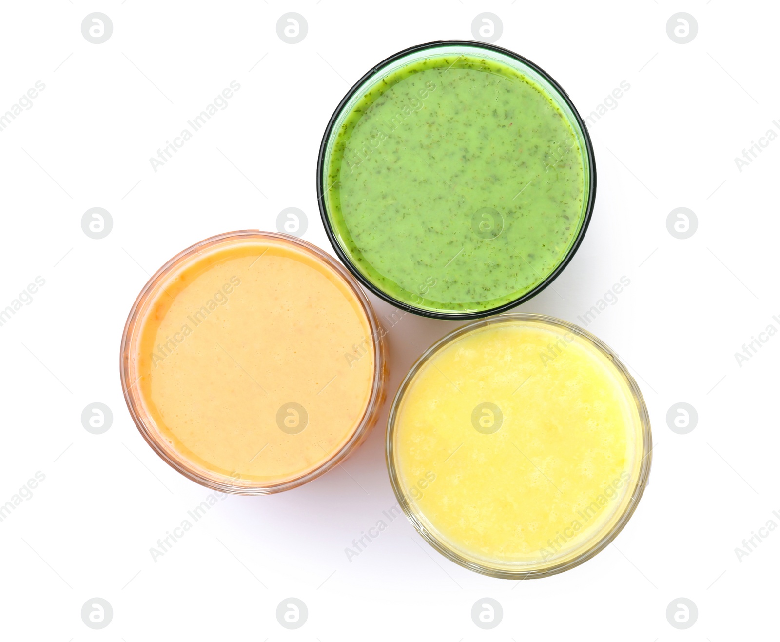 Photo of Glasses with delicious detox smoothies on white background, top view