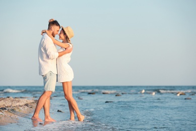 Young couple spending time together on beach