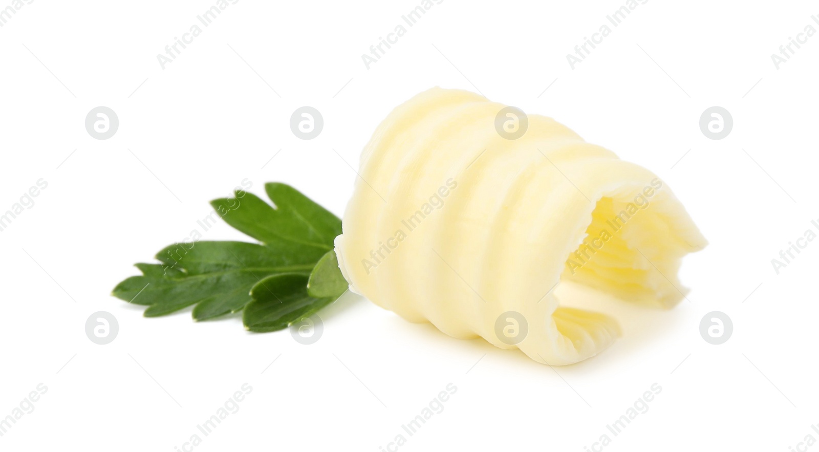 Photo of Tasty butter curl and fresh parsley isolated on white