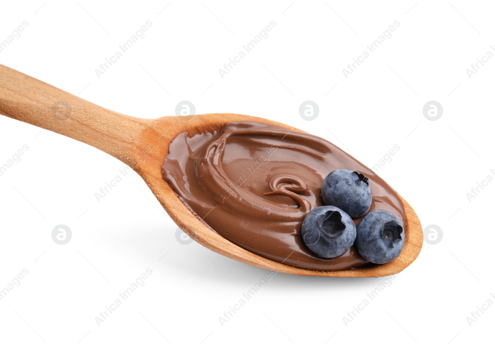 Photo of Wooden spoon with delicious chocolate paste and blueberries isolated on white