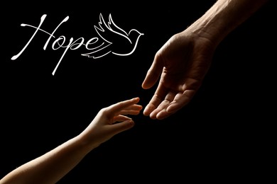Concept of hope. Man with child on black background, closeup of hands