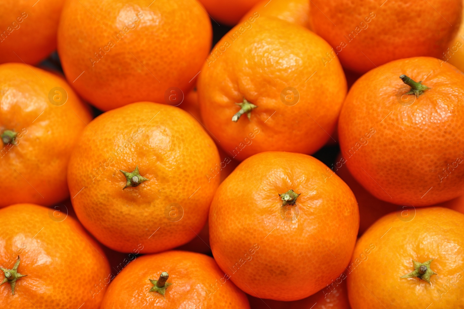 Photo of Delicious fresh ripe tangerines as background, closeup