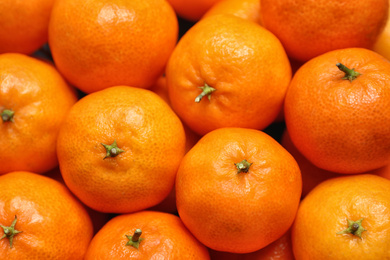 Photo of Delicious fresh ripe tangerines as background, closeup