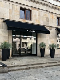 Photo of WARSAW, POLAND - JULY 17, 2022: Official LA MANIA store on city street