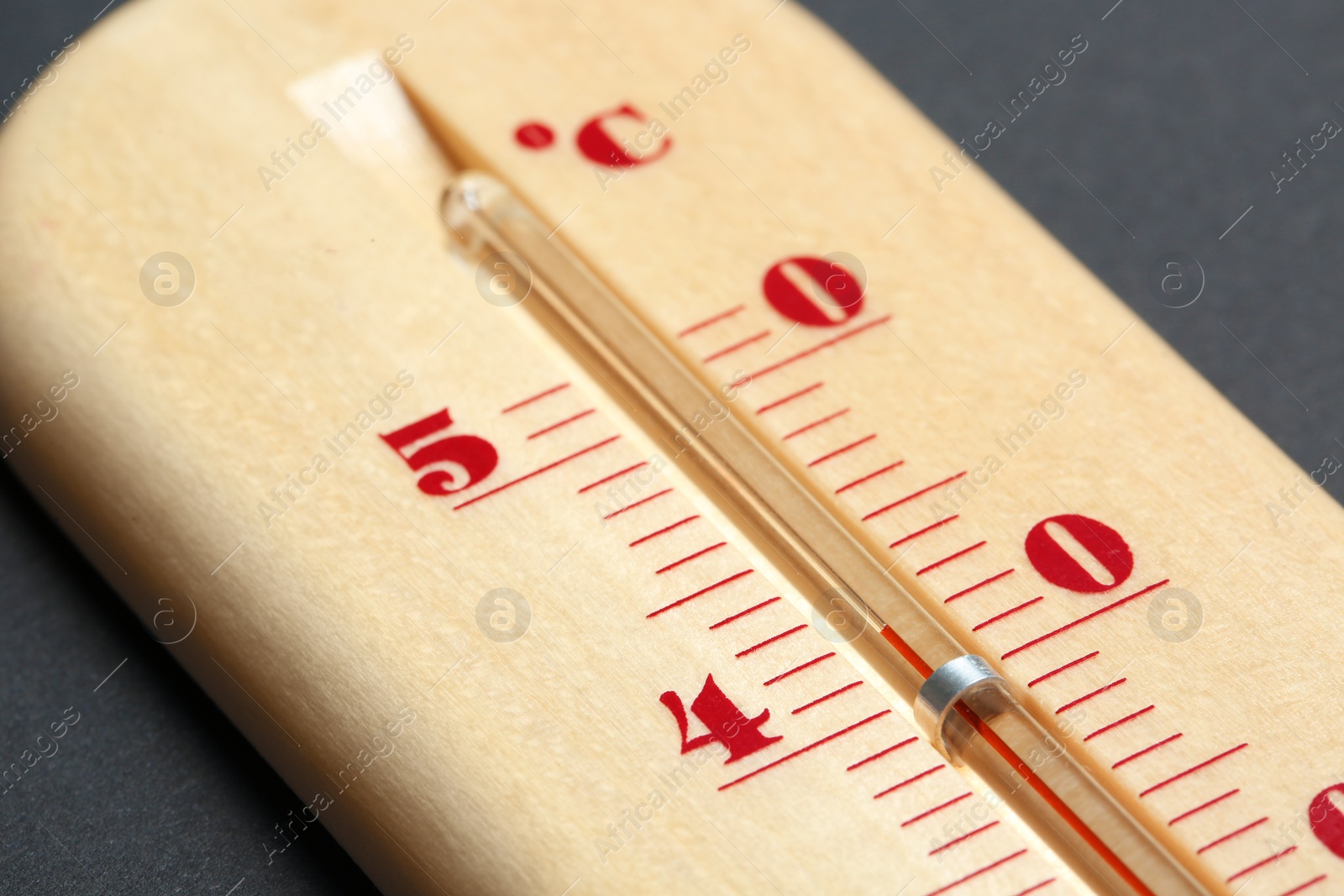 Photo of Weather thermometer on dark background, closeup view