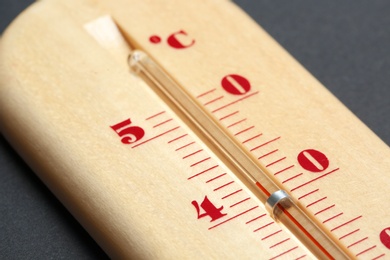 Weather thermometer on dark background, closeup view