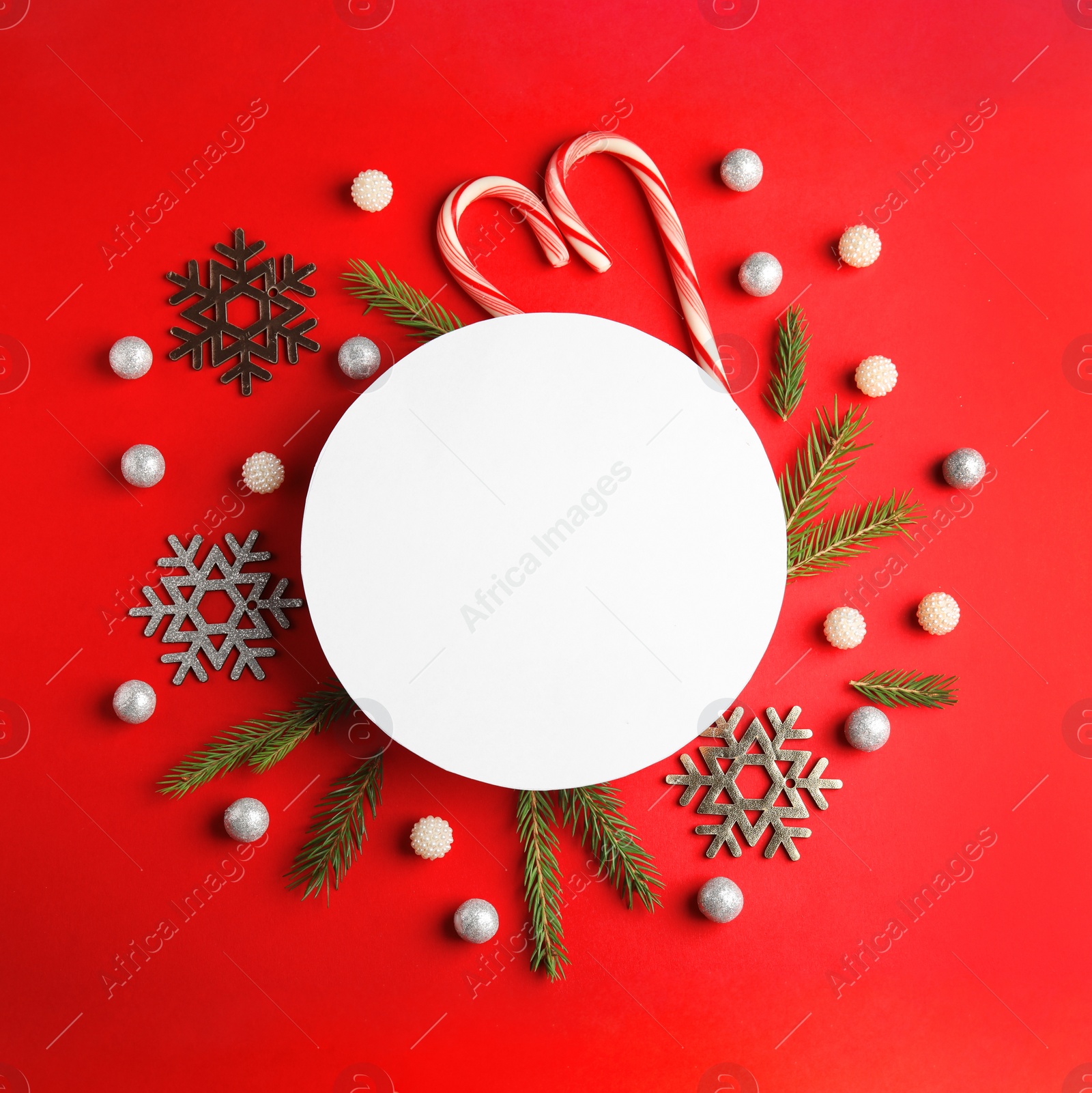 Photo of Flat lay composition with Christmas decor on red background