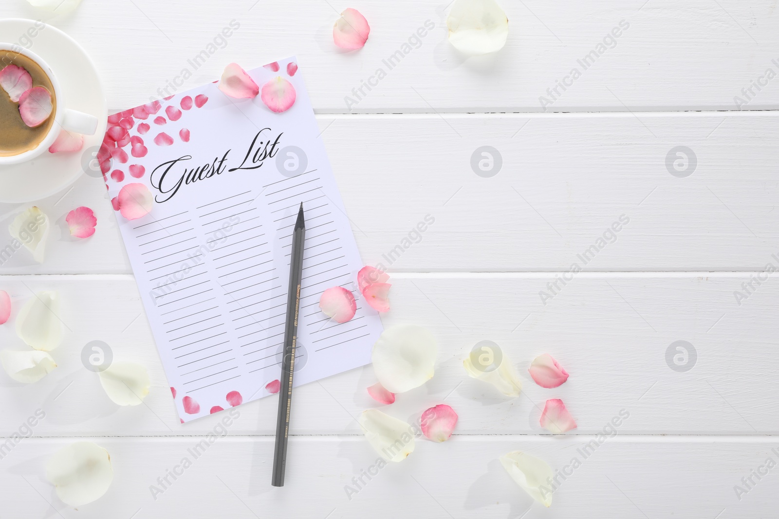 Photo of Guest list, pencil, coffee and petals on white wooden table, flat lay. Space for text