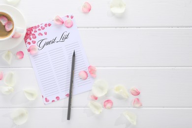 Guest list, pencil, coffee and petals on white wooden table, flat lay. Space for text