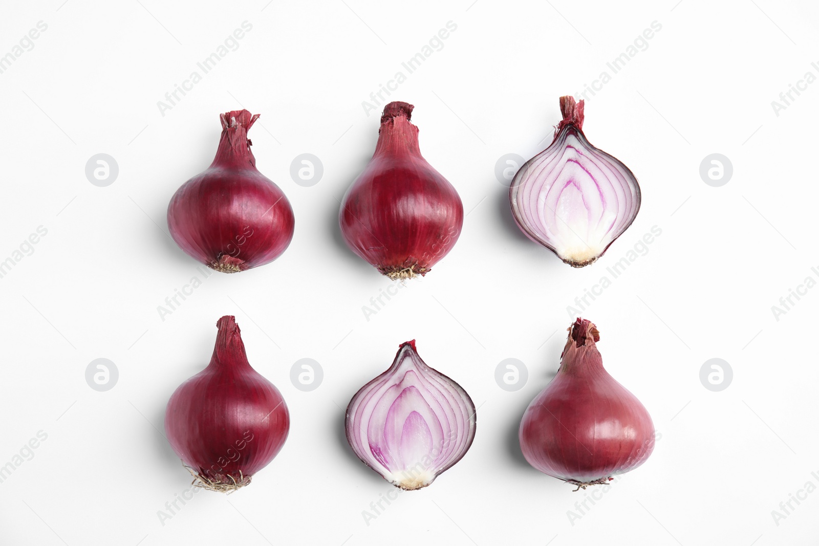 Photo of Beautiful composition with ripe red onions on white background