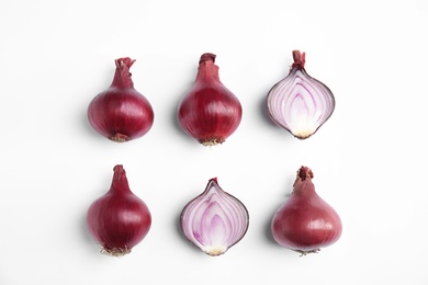 Beautiful composition with ripe red onions on white background